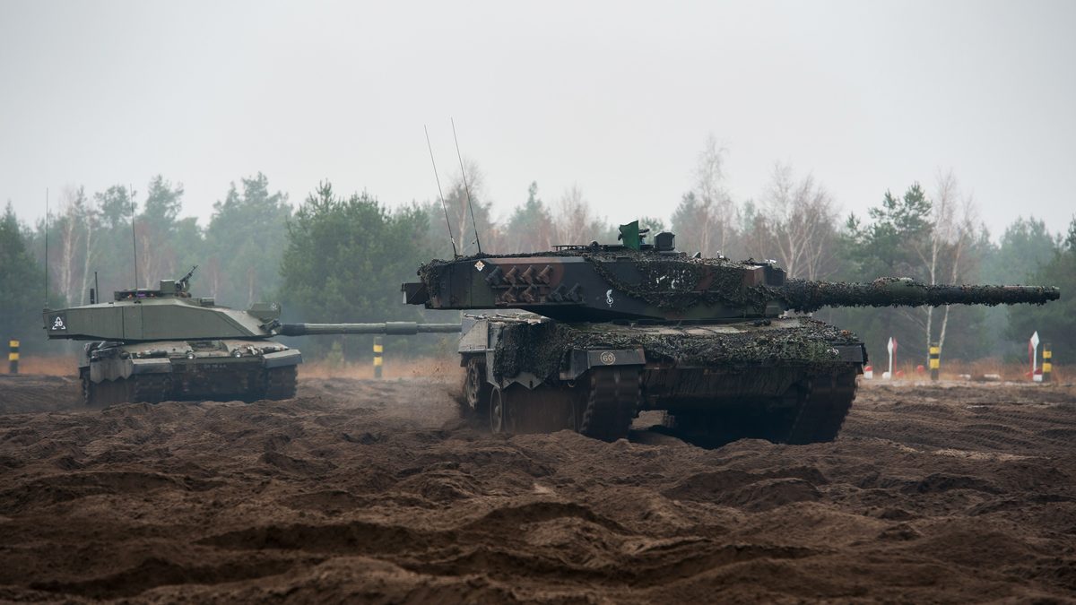A British Challenger 2 main battle tank (120mm rifled L30) and a Polish Leopard 2 main battle tank (120mm smoothbore) operating together on NATO exercise, illustrating the Alliance&rsquo;s mixed 120mm fleet environment.