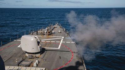 Mark 45 5-inch gun aboard USS John S. McCain fires during live-fire exercise
